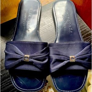 Pair of Navy Blue Kate Spade bow slides.